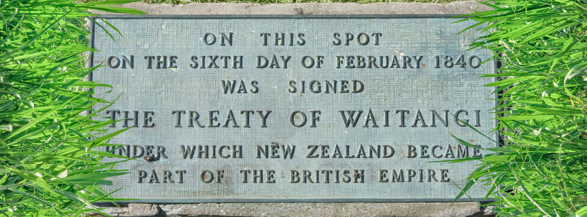 A photo of the plaque on the field at Waitangi which reads "On this spot on the sixth day of February 1840 was signed the Treaty of Waitangi under which New Zealand became a part of the British Empire. Gross.