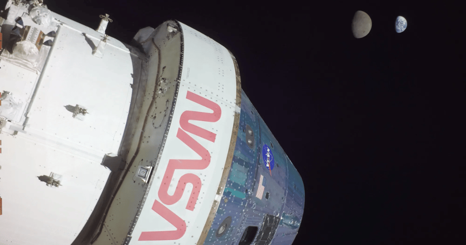 NASA's Orion capsule with the Moon and earth in the background.