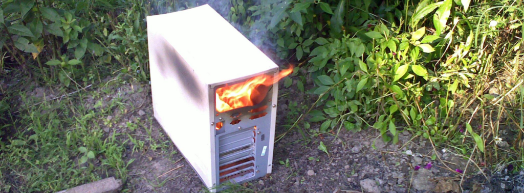 An old PC on fire.
